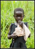 Aloyo Innocent - 6 years old and attends Awere Primary School.